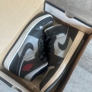 Jordan 1 Shadow Black and Gray Sneakers with Red Accent